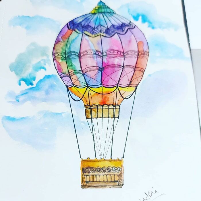 Colorful hot air balloon drawing in the sky, showcasing creative drawing prompts.
