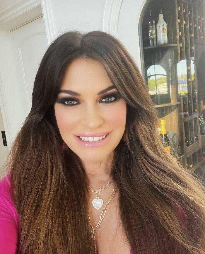 Politician-Adjacent Woman With Absolutely No Skin Texture, But With Bonus Eye Makeup Filter Going Into Her Hair