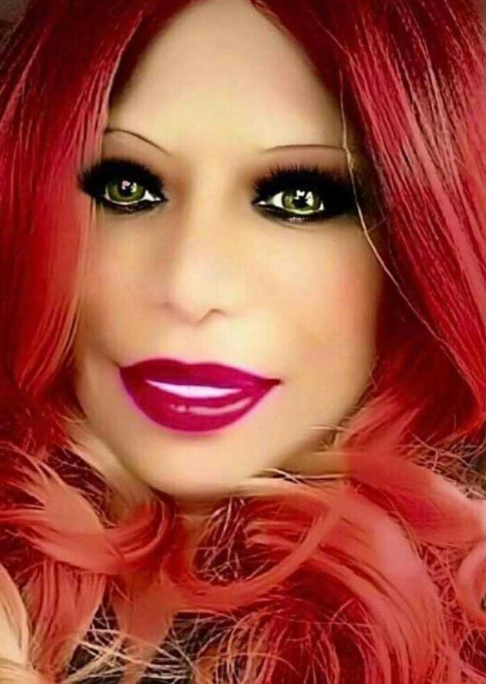 Close-up of a person with red hair and heavy makeup, illustrating Instagram reality and fake pics online.