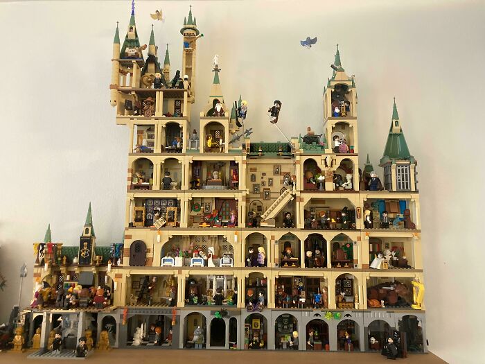 Intricate LEGO builds showcasing a multi-level castle with detailed figures and architectural elements as real works of art.