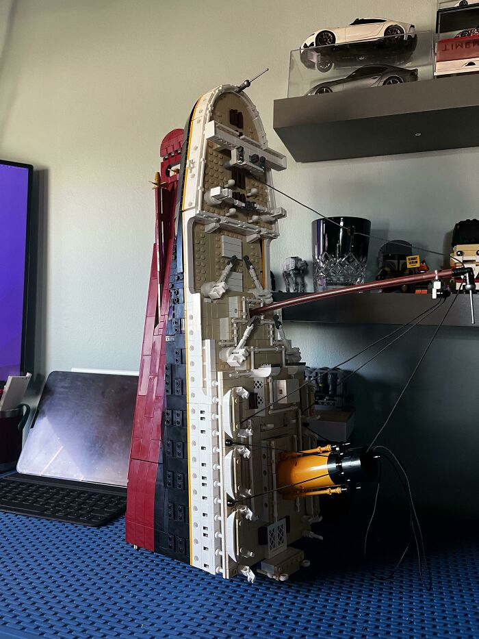 Detailed LEGO build of a ship's interior and exterior, showcasing incredible craftsmanship and intricate design elements.