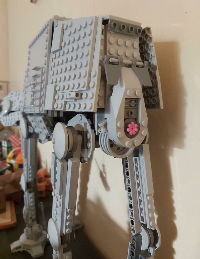 LEGO build of a detailed Star Wars AT-AT walker model featuring articulated legs and realistic design elements.