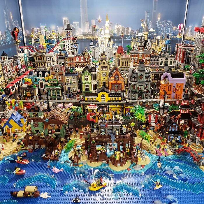 Intricate LEGO builds featuring a bustling cityscape and beach scene showcasing incredible LEGO art and creativity.