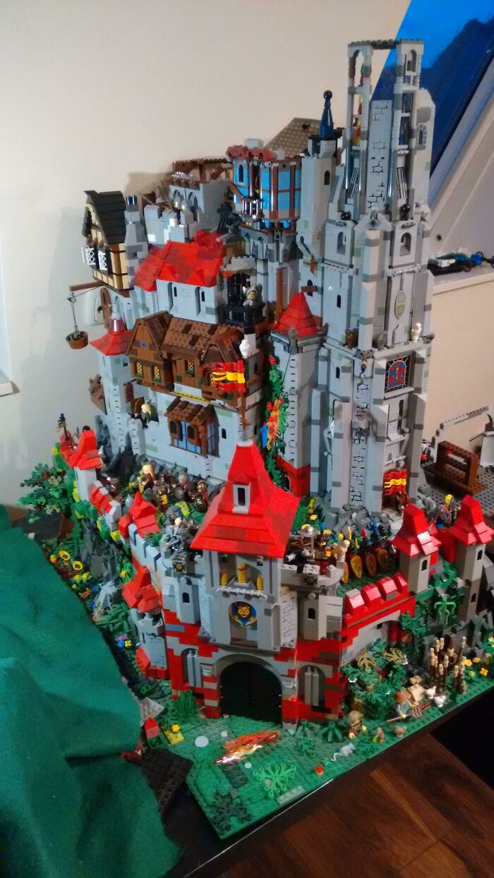 Detailed LEGO castle build with intricate design, minifigures, and vibrant colors showcasing incredible LEGO builds art.