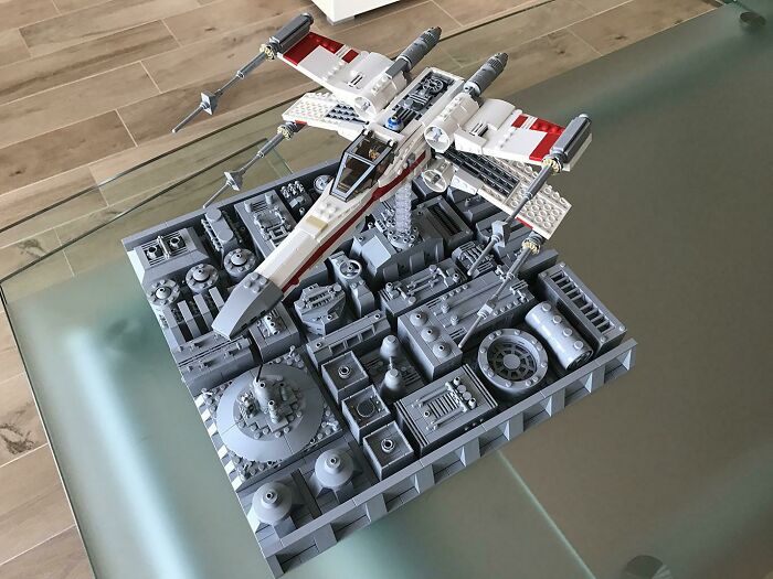 Detailed LEGO build of a sci-fi aircraft displayed on a complex base showcasing incredible LEGO builds as art.