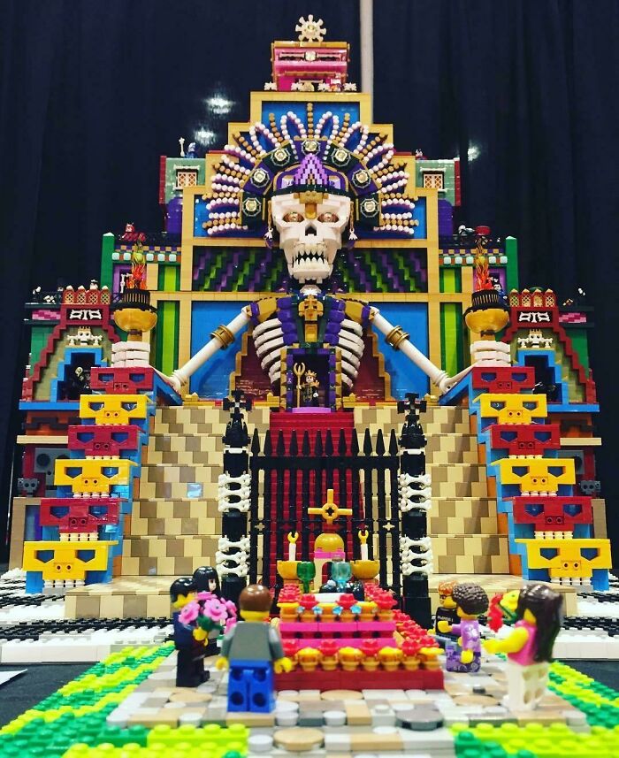Intricate LEGO build of a colorful skeletal figure with an audience, showcasing incredible LEGO art and creativity.