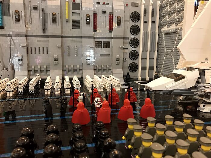 LEGO builds depicting a detailed Star Wars scene with stormtroopers and imperial guards in a large model setting.