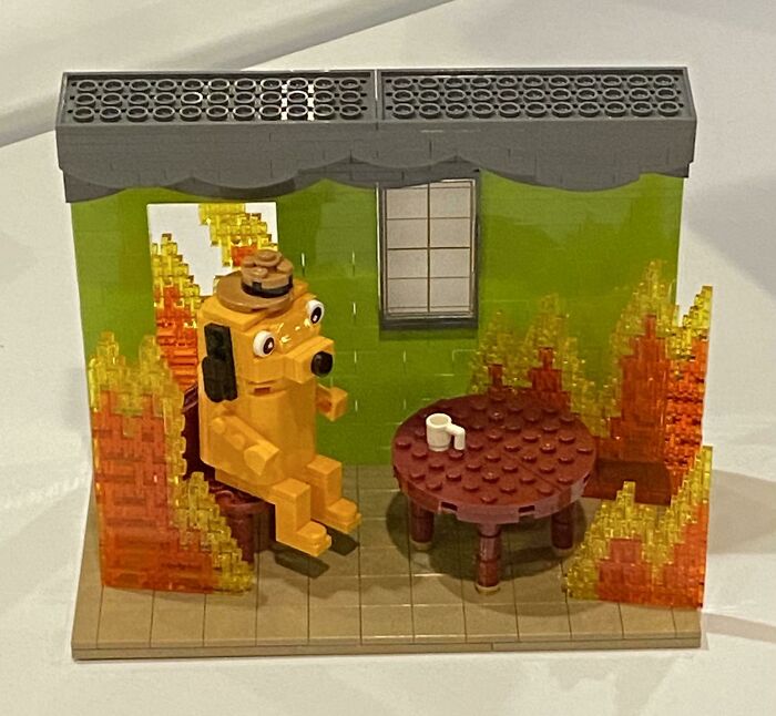LEGO builds showing a dog figure sitting at a table surrounded by orange and yellow flames inside a green room.