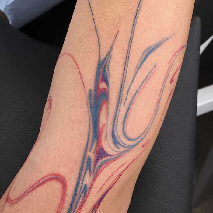 Flowing tattoo design inspired by traditional marbling art on forearm. Flowing tattoo design inspired by traditional marbling art on forearm.