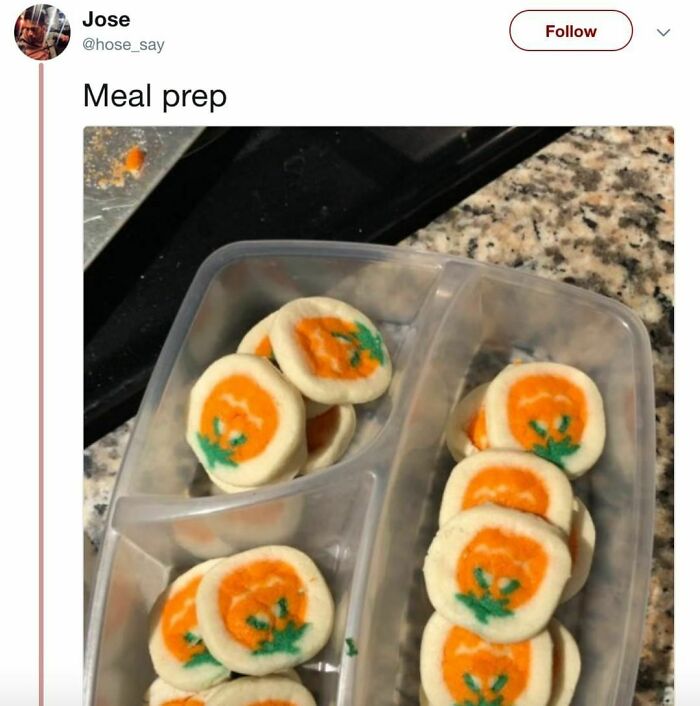 Halloween-themed cookies with pumpkin designs in a plastic container, labeled "meal prep."