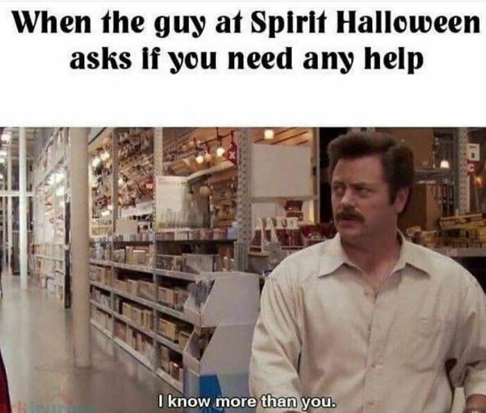 Man in a store with a humorous Halloween meme about needing help, saying "I know more than you."