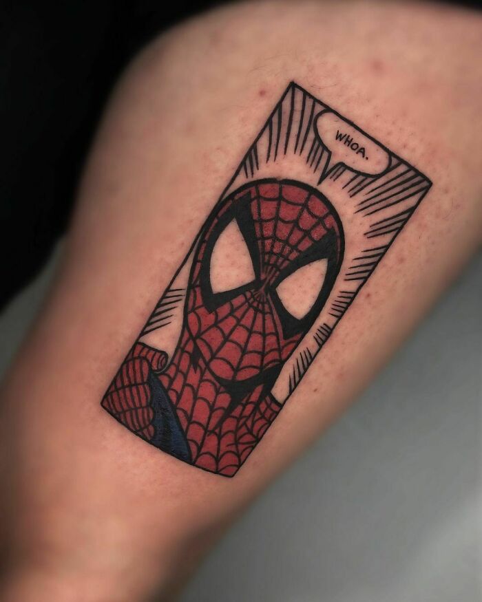 Marvel tattoo of Spider-Man on forearm, showcasing comic-style design with a speech bubble saying "Whoa."