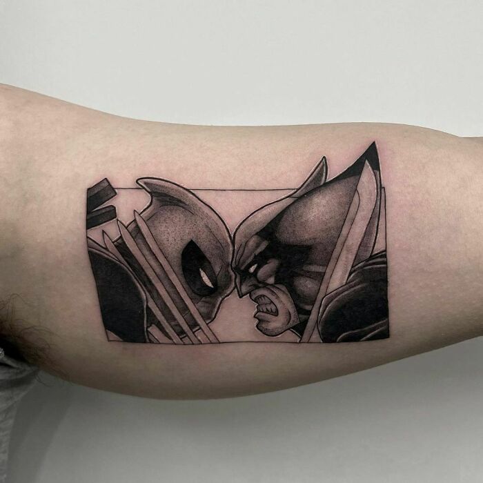 Marvel tattoos featuring Deadpool And Logan clashing heads, inked on a person's arm.