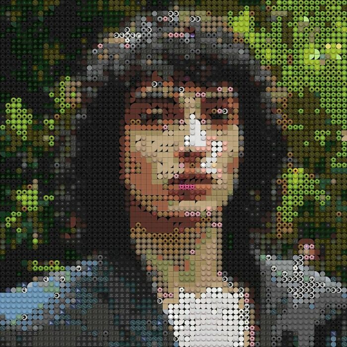Portrait of a woman created using intricate LEGO builds showcasing detailed and artistic brickwork in a mosaic style.