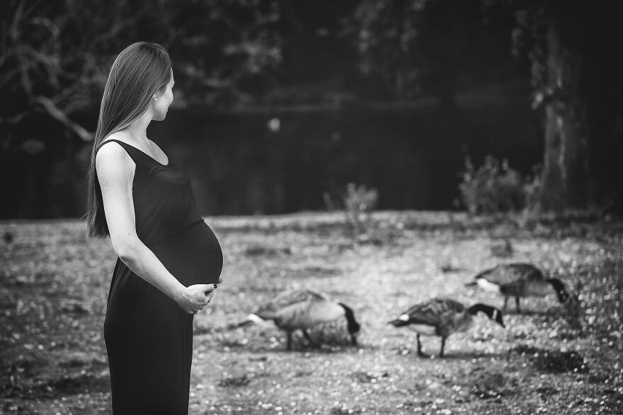 Black and white photograph of a pregnant woman