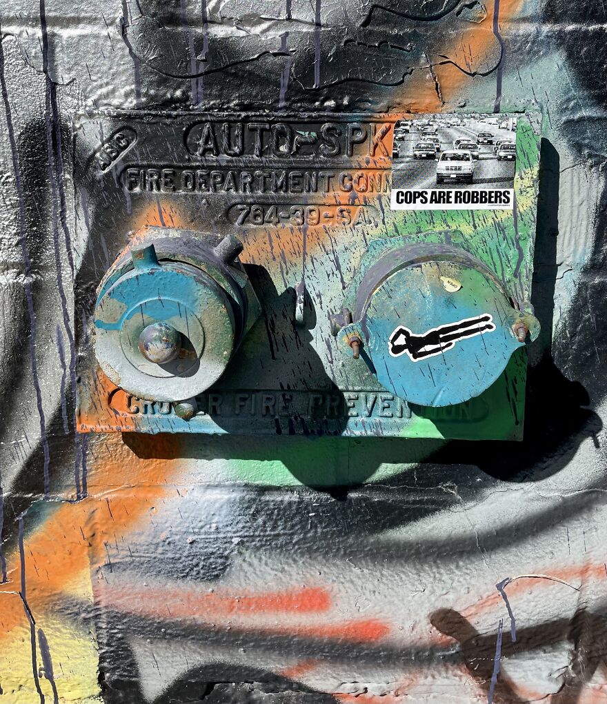 Spraypainted Standpipe With "Cops Are Robbers" Sticker (That's True Sometimes But Not Always)