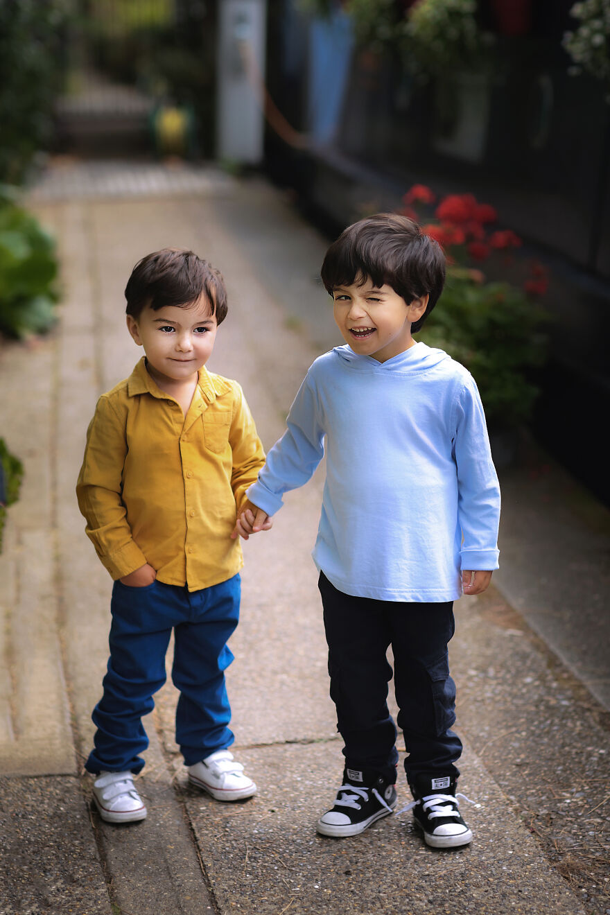 A photograph of two brothers holding hands