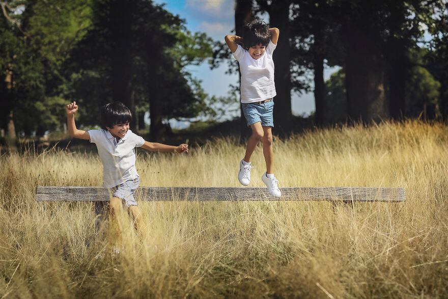 Photograph of two cheerful kids in a afield
