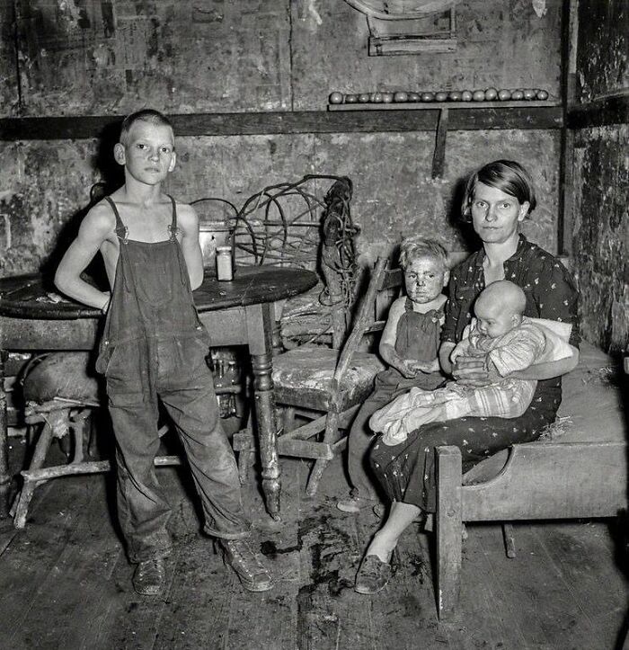 Coal Miner's Wife And Three Of Their Children. Company House In Pursglove, Scotts Run, West Virginia, September 1938