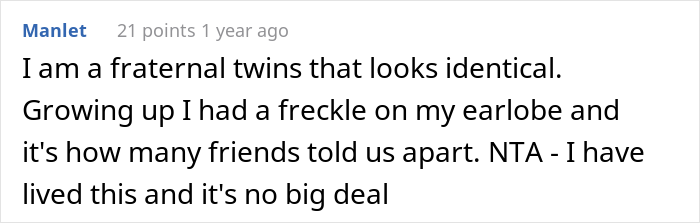 Comment about fraternal twins looking identical, with a personal anecdote of a distinguishing freckle.