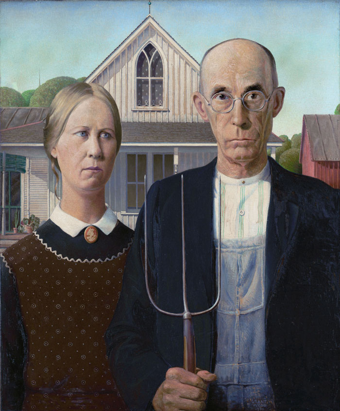 Famous portrait painting of two serious figures, one holding a pitchfork, in front of a farmhouse.