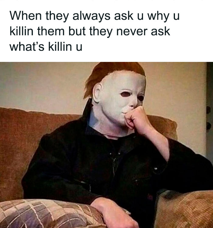 Masked character sitting thoughtfully on a couch, meme humor highlighting Halloween's spooky and hilarious theme.