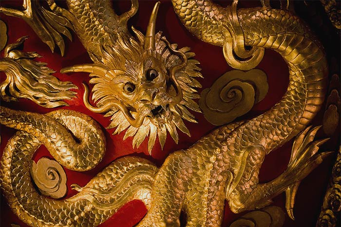 Golden statue on a wall of Chinese Dragon 