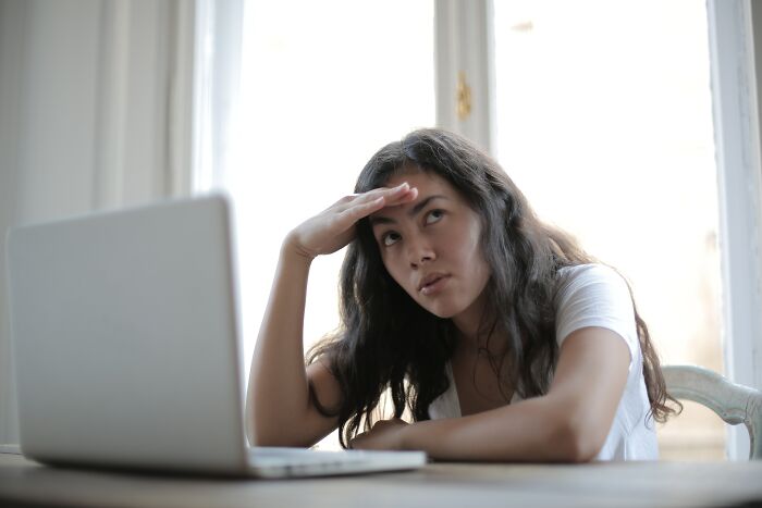 Feed Up Woman While Working On Laptop 