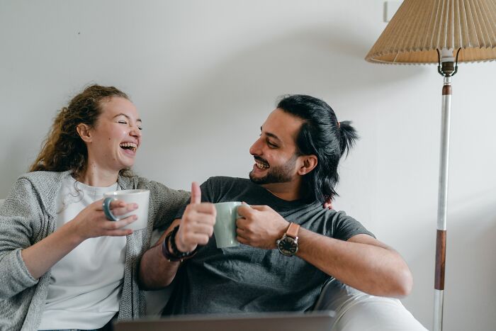 Couple Drinking Tea And Having Fun 