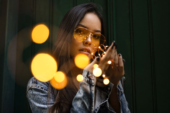 Woman looking and holding lights