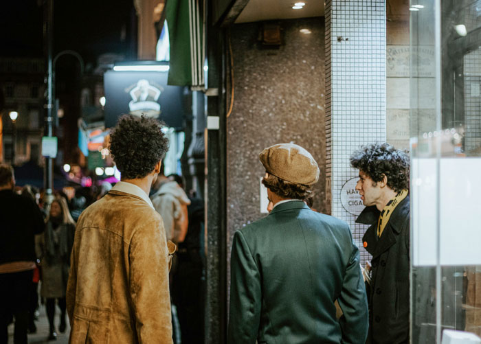 People talking near the bar entrance