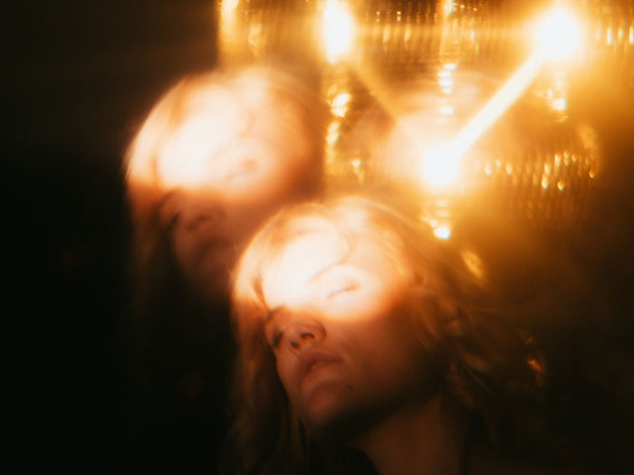 Woman in the dark with lighted face