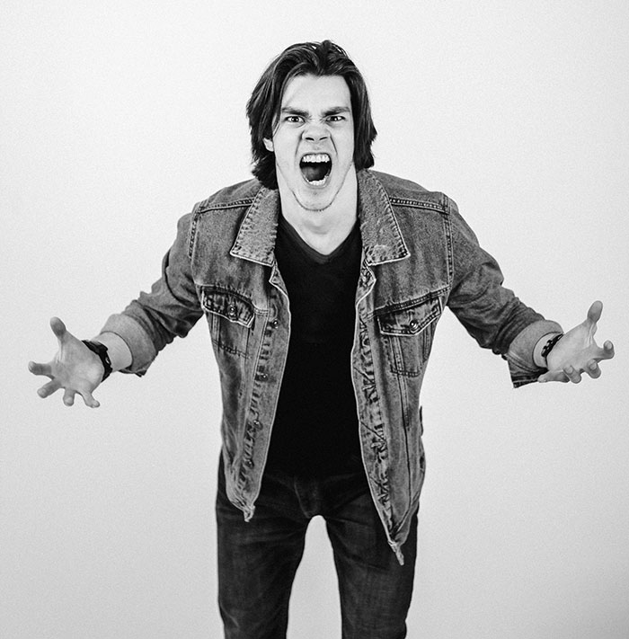 Person standing and screaming