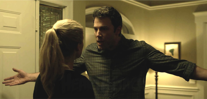 A tense confrontation between a man and woman showing signs of a fake friend and toxic relationship conflict.