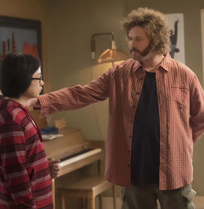 Man in checkered shirt confronting a woman in glasses, illustrating signs of a fake friend in a toxic relationship.