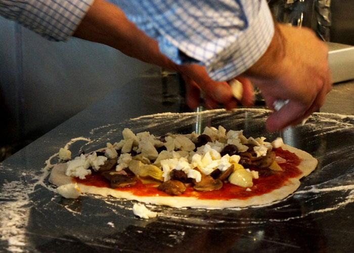 Pizza Maker Tries To Explain To Couple That They Ordered Too Many Toppings And The Pizza Won&rsquo;t Cook, They Insist And The Worker Maliciously Complies