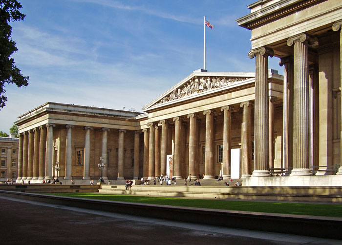 Neoclassical museum building with large columns under a clear sky, representing curious facts in art history.