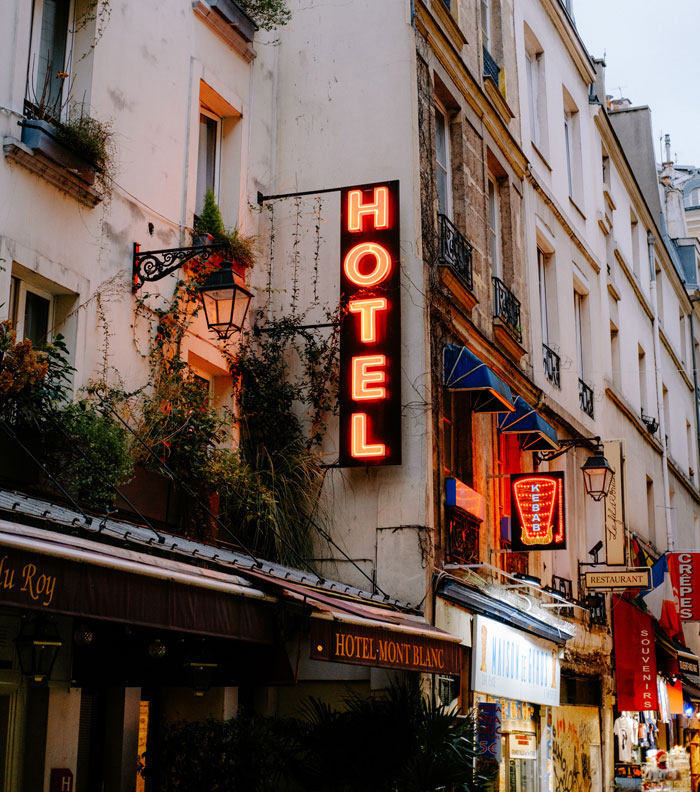 Photo of hotel with neon sign