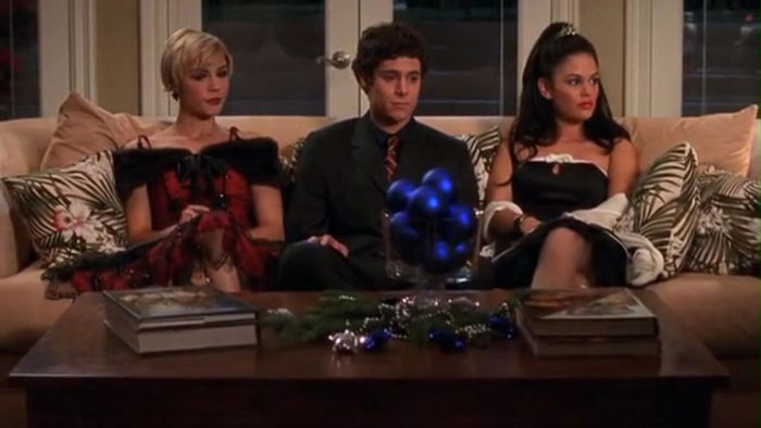 Marissa, Seth and Summer sitting on the couch 