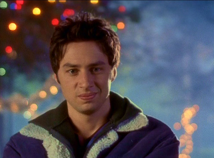 J.D wearing a blue jacket 