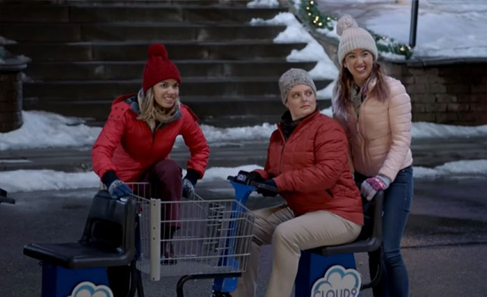 Dina driving a shopping cart 