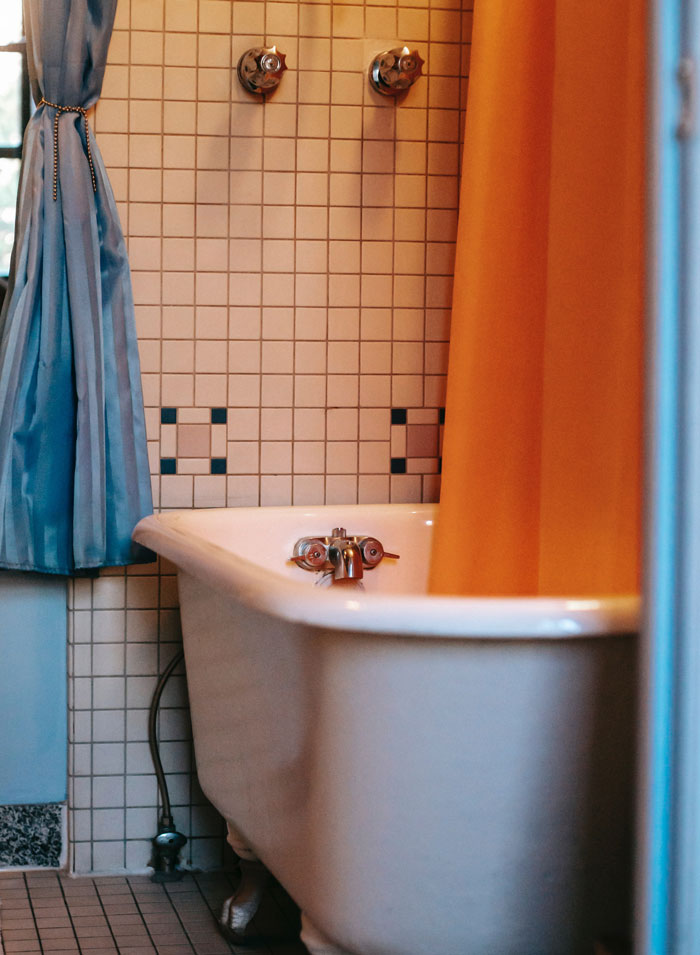 Pulling Back the Shower Curtain To Check For Potential Serial Killers Hiding Behind It