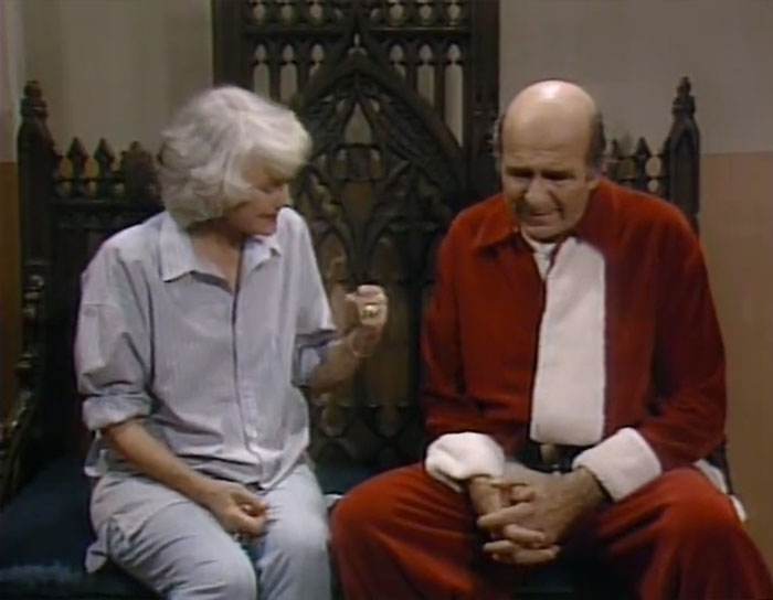 Dorothy talking to a man wearing Sant's costume 