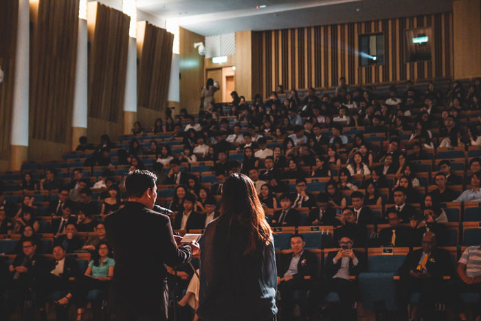 Man and woman in front of the audience 