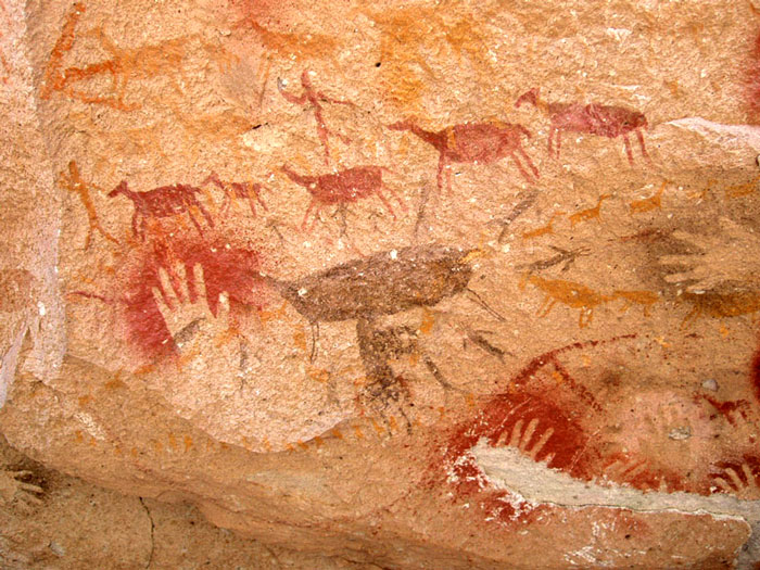 Ancient hunting scene drawings on rock walls at Cuevas de las Manos, showcasing curious facts in art history