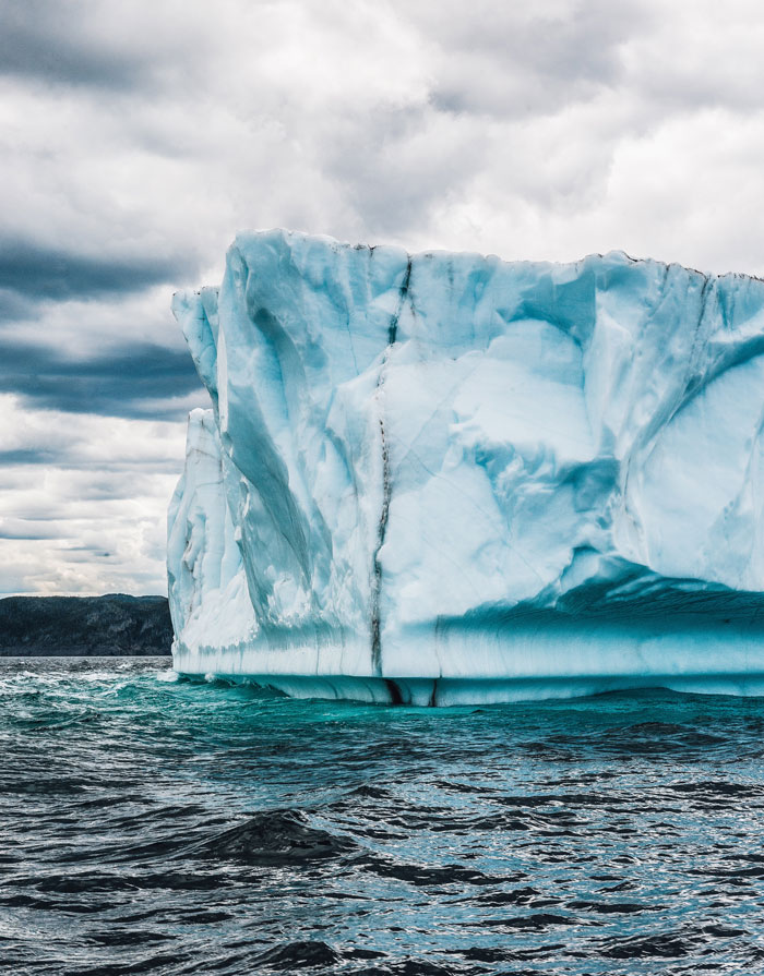 Kayak Through Icebergs In Greenland