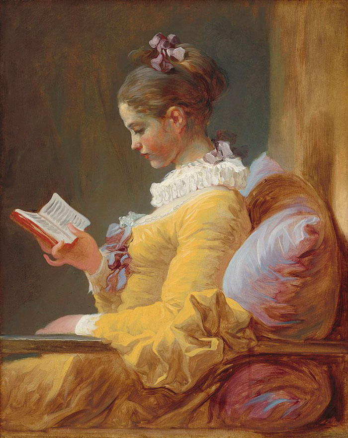 Young girl in a yellow dress reading a book, showcasing curious facts about art not commonly taught in art classes.