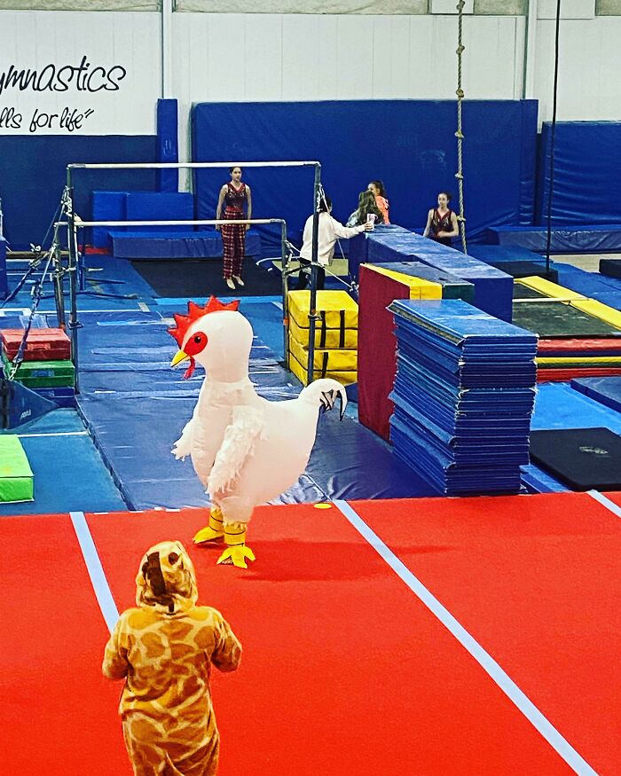 Kids in a chicken and giraffe Halloween costume having fun at a gymnastics gym, capturing moments that made parents laugh hard.