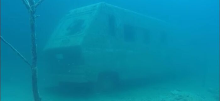 An Underwater Class A Rv In A Quarry Dive Site