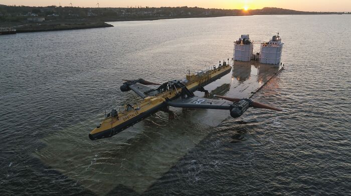 A Tidal Turbine About To Be Submerged Off The Coast Of Scotland